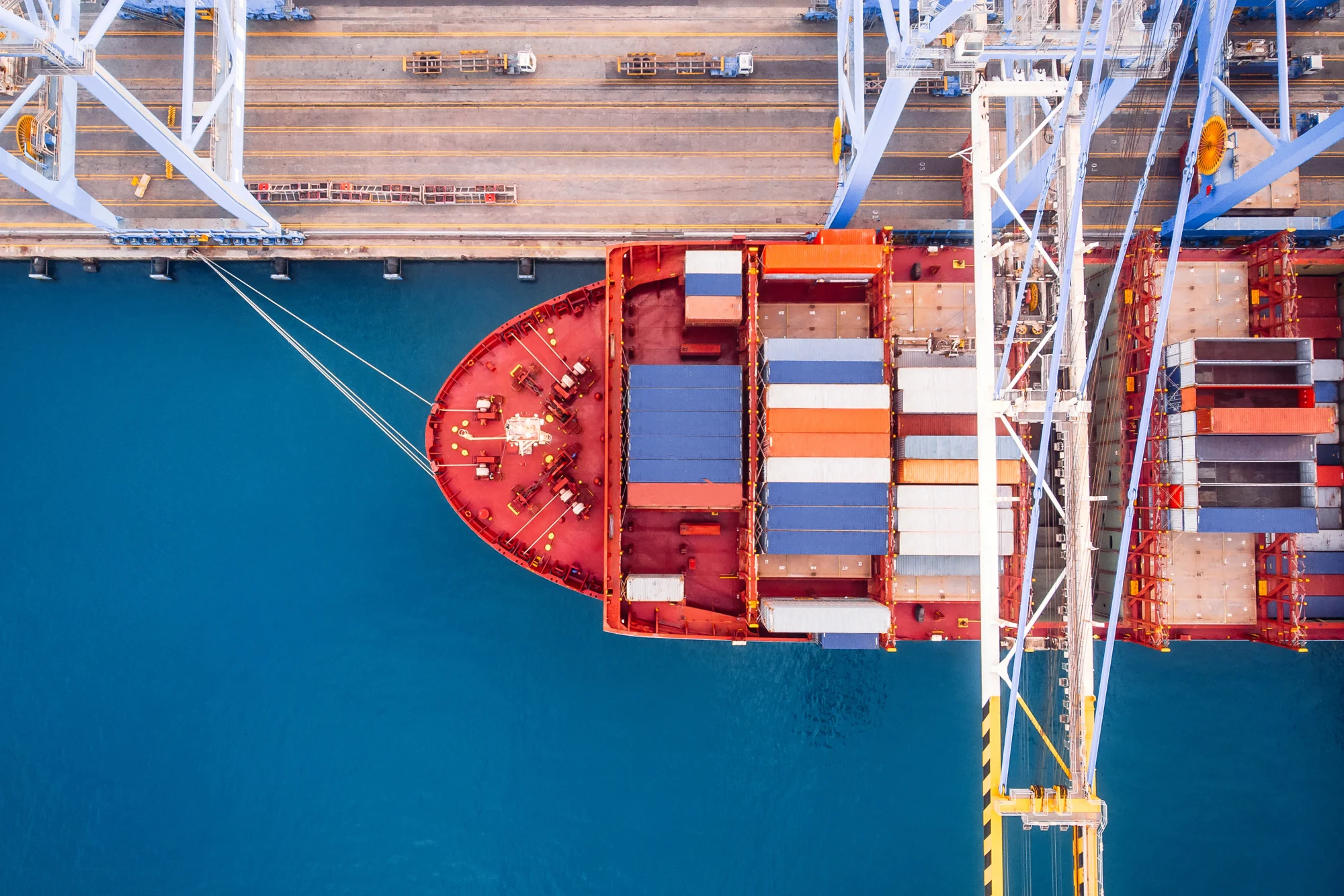 Cargo vessel and cranes at a busy port